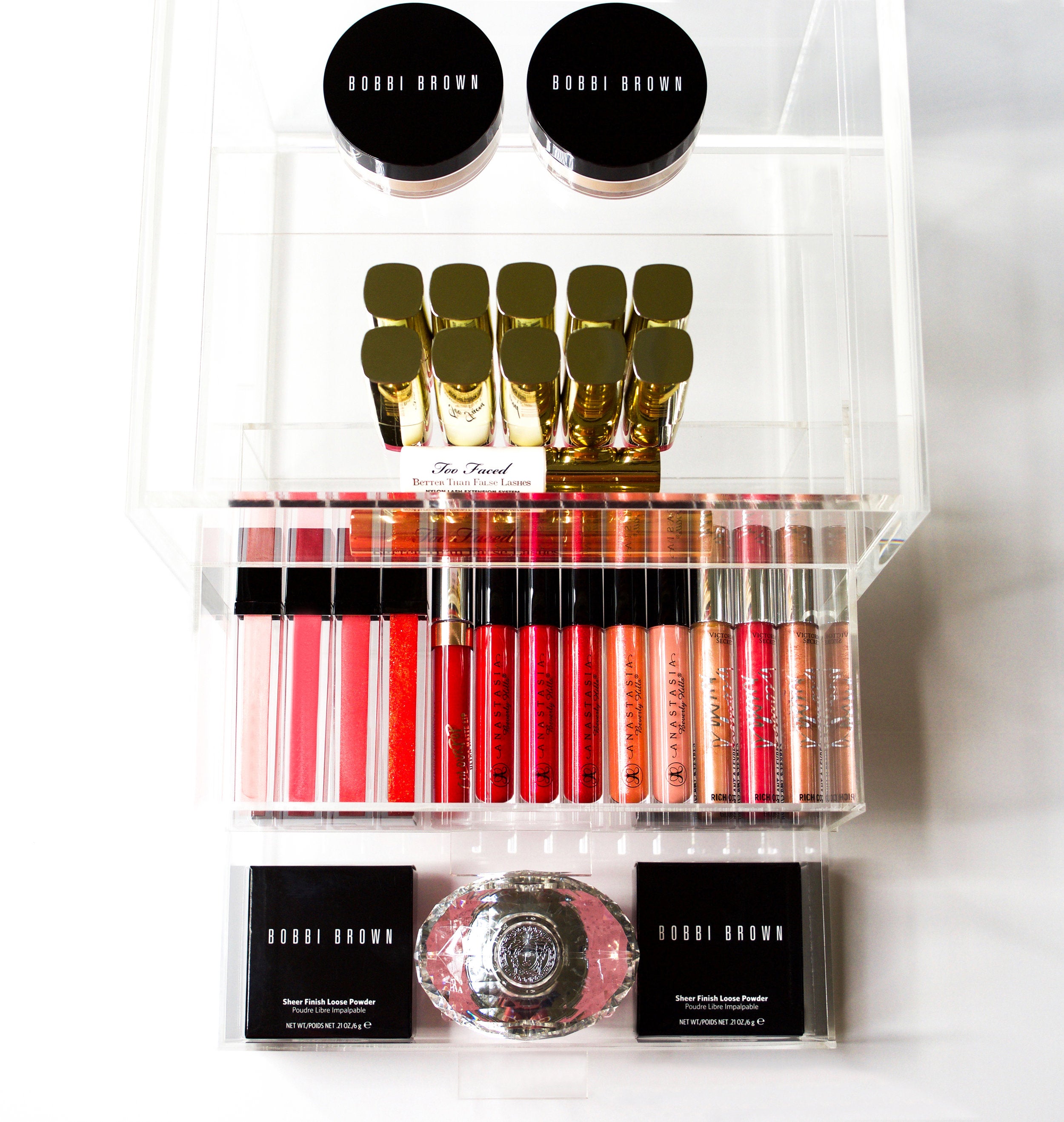 acrylic makeup organizer filled with Bobby Brown Makeup