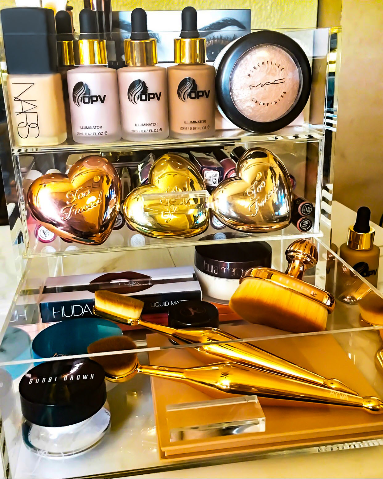 An Acrylic Makeup Organizer filled with makeup